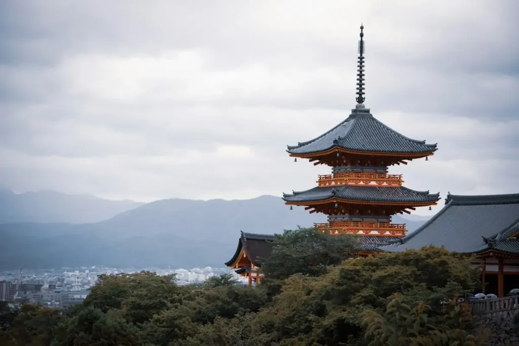 Torii gates and historic temple architecture in Kyoto Japan