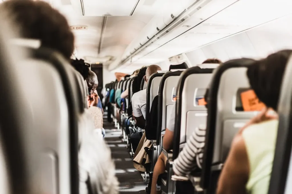 Airplane passenger resting comfortably with eye mask on long-haul flight