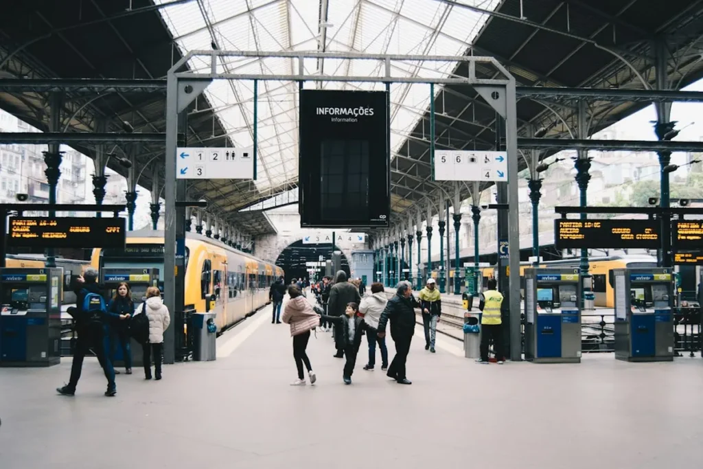 Budget backpacker traveler with map at a historic European train station