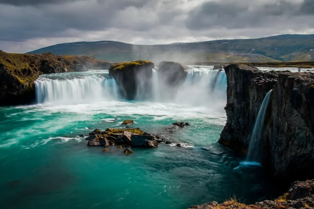 Scenic Ring Road winding through volcanic mountains and waterfalls in Iceland